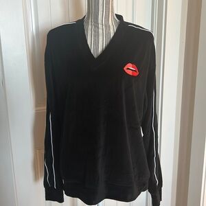 This is a set.  Like new black velour jogger top/bottoms